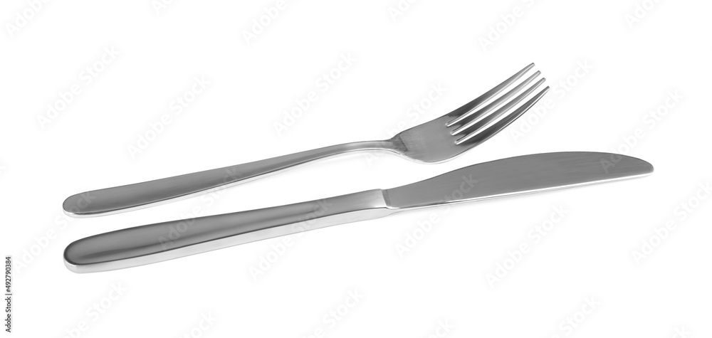 Shiny fork and knife on white background Shiny fork and knife on white background