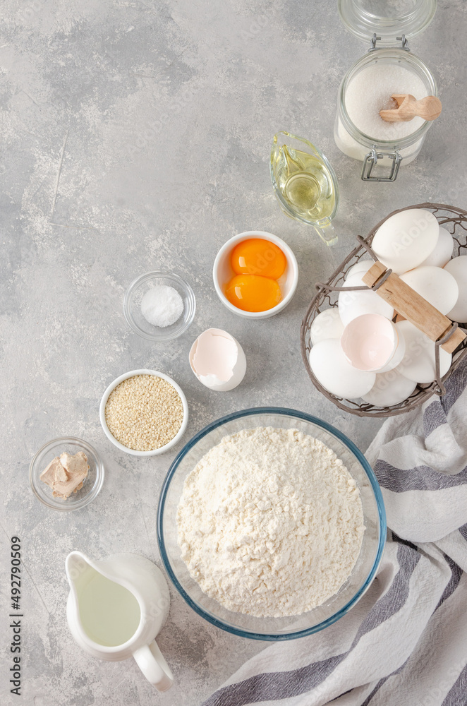 Ingredients for the preparation of challah bread dough, flour, water, sugar, eggs, yeast, oil, salt. Top view, copy space. Ingredients for the preparation of challah bread dough, flour, water, sugar, eggs, yeast, oil, salt. Top view, copy space.