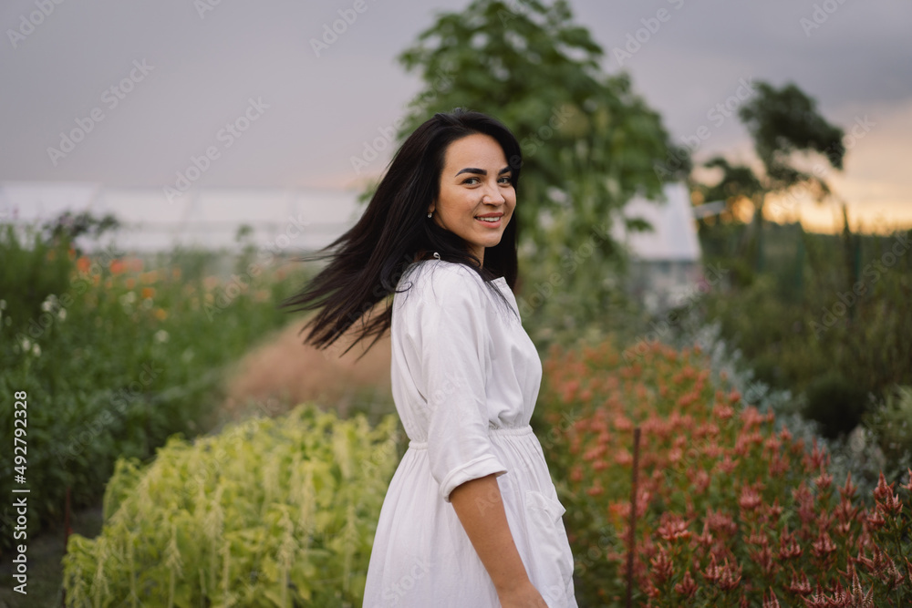 Portrait of beautiful young woman with black hair. Happy woman smiling