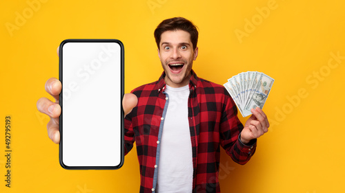 Man holding money and big white empty smartphone screen