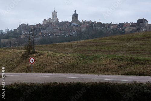 Vezelay, France - February 23 , 2022: Vezelay Abbey is a Benedictine and Cluniac monastery in the Bourgogne-Franche-Comte. Cloudy winter day. Selective focus. photo