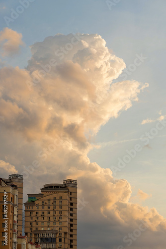 Obolon, Kyiv. Top of a high-rise building under a huge orange cloud © maxsyd