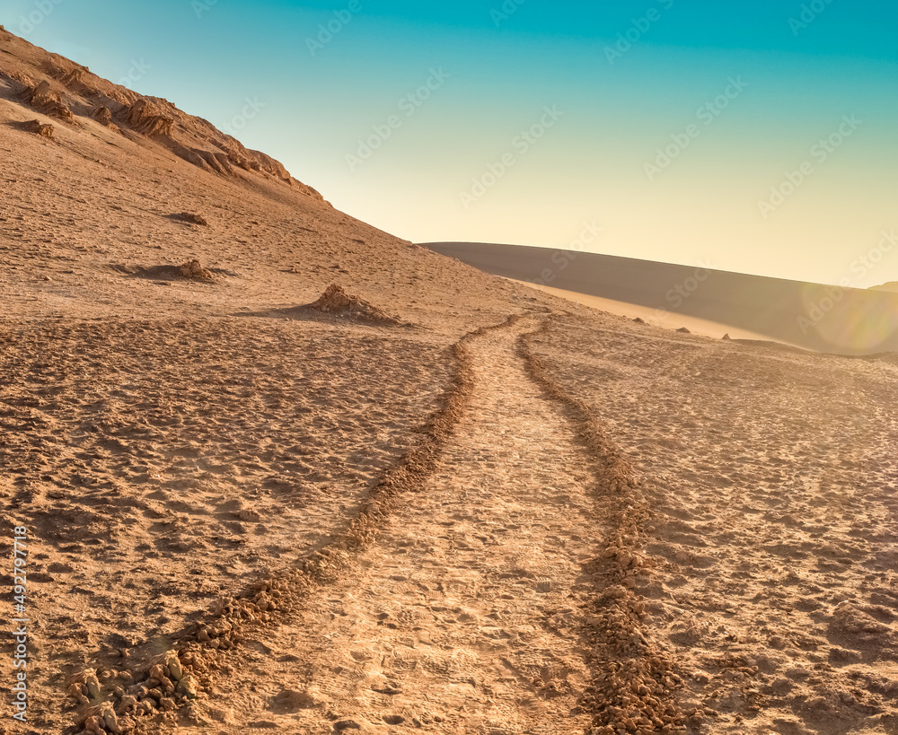 Stunning desert landscapes in the Valley of Moon (Valle de la Luna), San Pedro de Atacama, Chile. Unique rock formations, cliffs sand dunes with infinite color and texture variations.