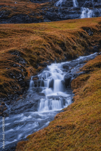 Fototapeta Naklejka Na Ścianę i Meble -  Europe, Faroe Islands. View of the village of Saksun and waterfalls on the island of Streymoy. November 2021