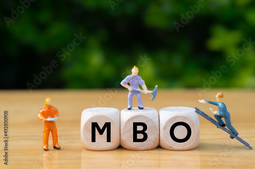 Management by objectives (MBO) is a strategic management model that aims to improve organizational performance by management and employees.word. photo