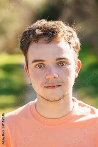 portrait of a Transman looking at the camera