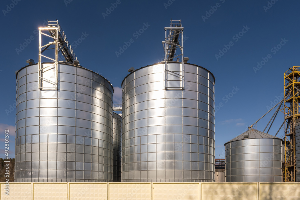 agro silos granary elevator on agro-processing manufacturing plant for processing drying cleaning and storage of agricultural products, flour, cereals and grain.