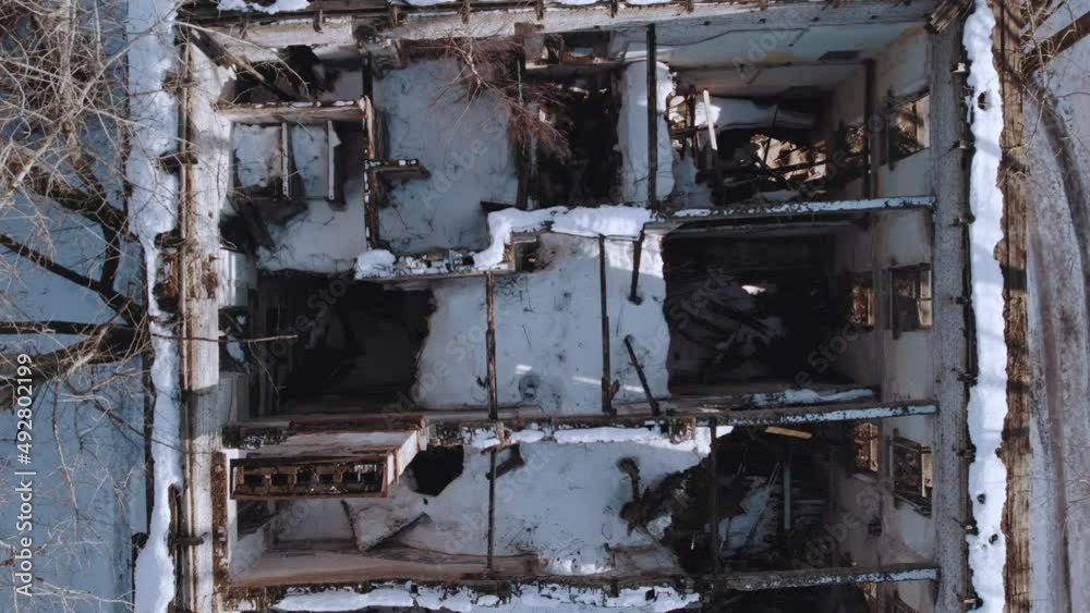A destroyed apartment building, a broken building, aerial photography of a house without a roof. A destroyed apartment building, a broken building, aerial photography of a house without a roof.
