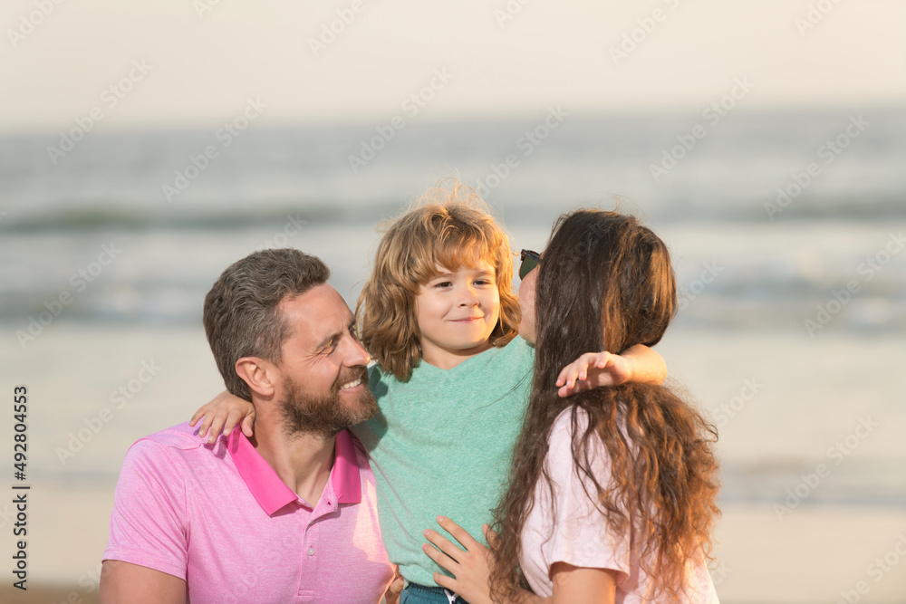 happy family of mother father and kid on summer beach happy family of mother father and kid on summer beach