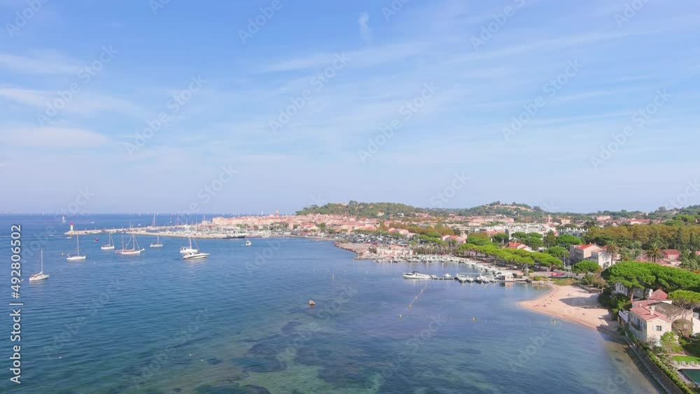 Saint-Tropez, France: Aerial view of city on French Riviera during regatta Les Voiles de Saint-Tropez, famous marina and lot of yachts and sailboats on Mediterranean Sea - landscape panorama of Europe Saint-Tropez, France: Aerial view of city on French Riviera during regatta Les Voiles de Saint-Tropez, famous marina and lot of yachts and sailboats on Mediterranean Sea - landscape panorama of Europe