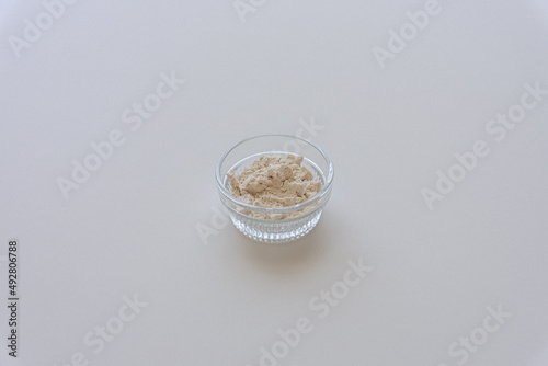 Raw fresh dried adlay flour on light white table.