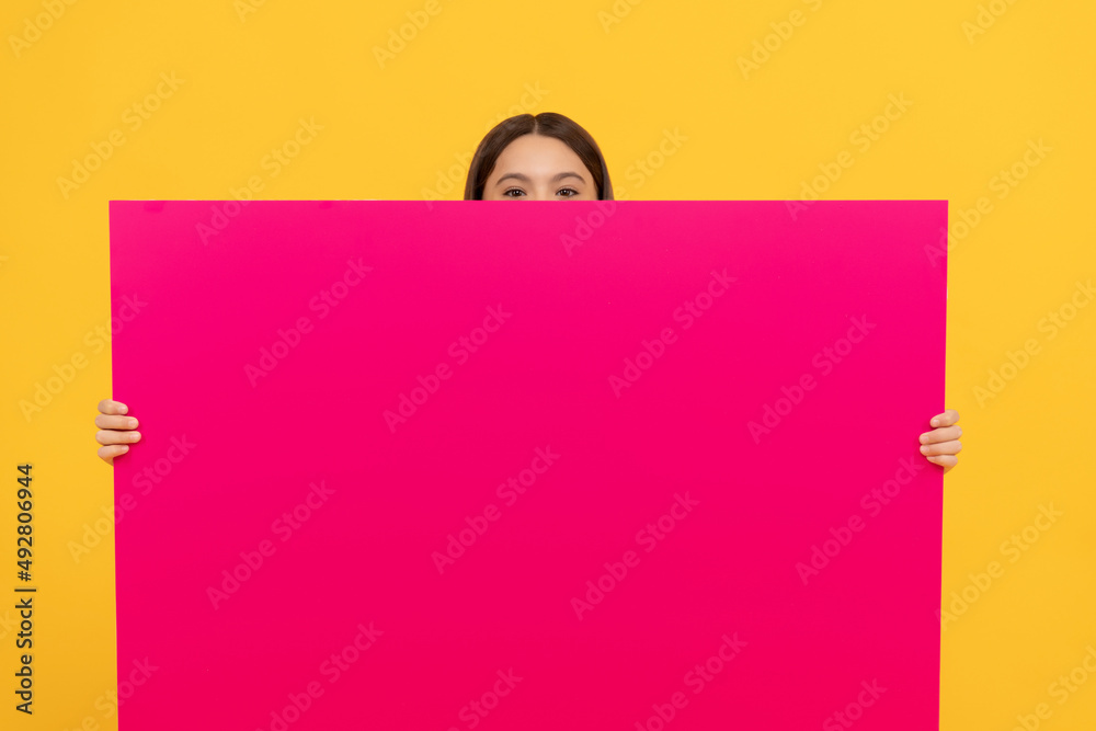 place for promotion and creativity. your marketing design. hiding teen girl with advertisement place for promotion and creativity. your marketing design. hiding teen girl with advertisement