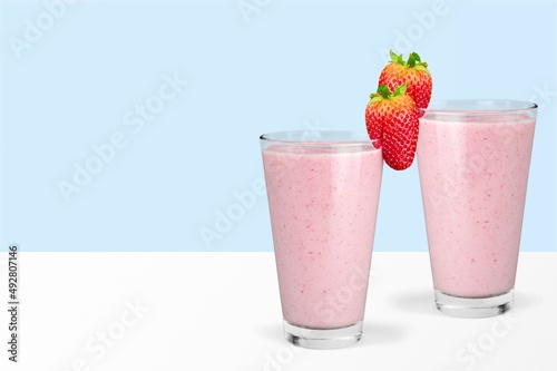 Protein rich smoothies with yogurt and frozen strawberries in glass. Bright berry
