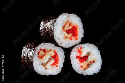 Cold cooked rice dressed with vinegar that is shaped into pieces and topped with raw or cooked fish, or formed into a roll with fish, egg, or vegetables and often wrapped in seaweed.