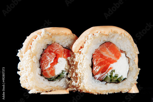 Cold cooked rice dressed with vinegar that is shaped into pieces and topped with raw or cooked fish, or formed into a roll with fish, egg, or vegetables and often wrapped in seaweed.