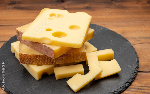 Swiss cheese collection, emmentaler with holes, gruyere, appenzeller fondue cheeses