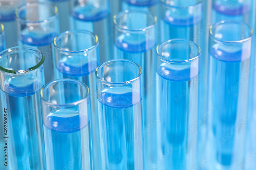 Test tubes with light blue reagents, closeup. Laboratory analysis Test tubes with light blue reagents, closeup. Laboratory analysis