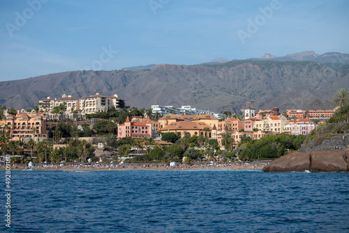 View on resorts and beaches of South coast of Tenerife island during sail boat trip along coastline, Canary islands, Spain © barmalini