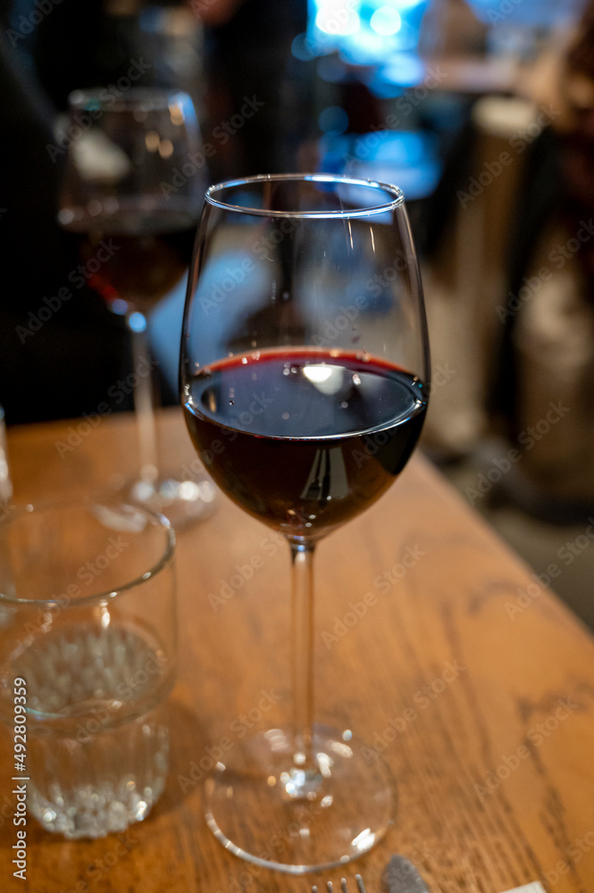 Tasting of dry Italian primitivo red wine in Italian cantina restaurant in Puglia