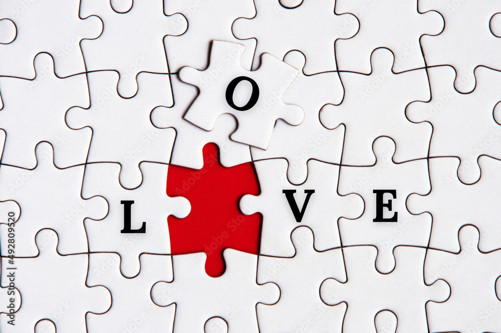 To view of text on missing jigsaw puzzle - Love. Love and romance concept To view of text on missing jigsaw puzzle - Love. Love and romance concept