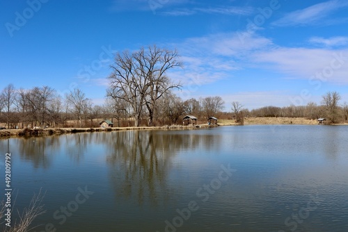 The quiet scene at the lake in the country on a sunny day.