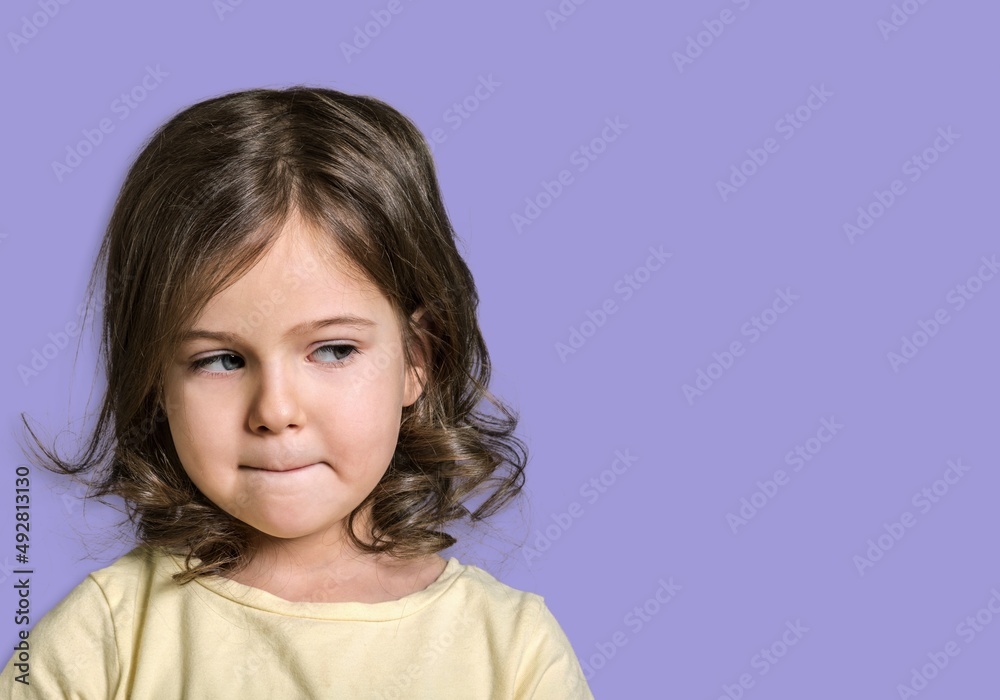 Let me think. Caucasian clever schooler with puzzled serious expression, child thinking Let me think. Caucasian clever schooler with puzzled serious expression, child thinking