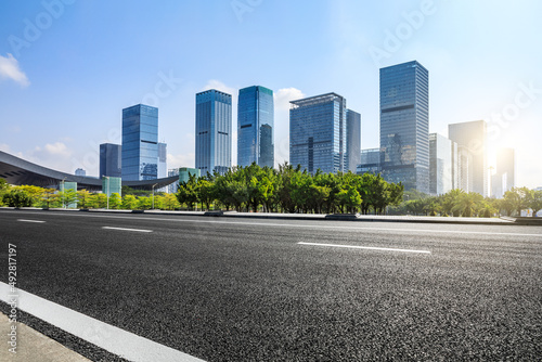 Asphalt road and city skyline with modern commercial buildings in Shenzhen, China. © ABCDstock