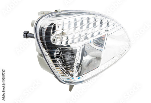 Stylish xenon headlight for truck or pickup - optical equipment with a lamp inside on a white isolated background. Spare part for auto repair in a car workshop.