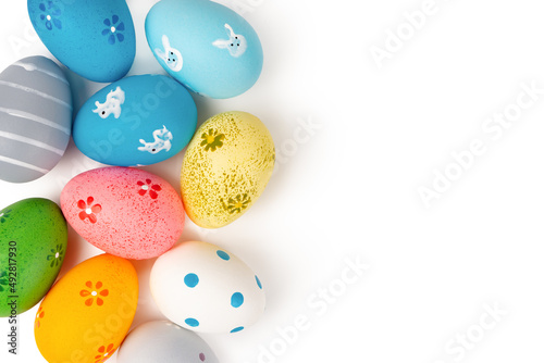 Colorful easter eggs isolated on whtie background. Easter mockup, top view, flat lay with copy space