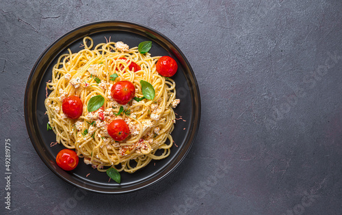 Spaghetti with oven-baked feta cheese, tomatoes and herbs. Fetapasta.