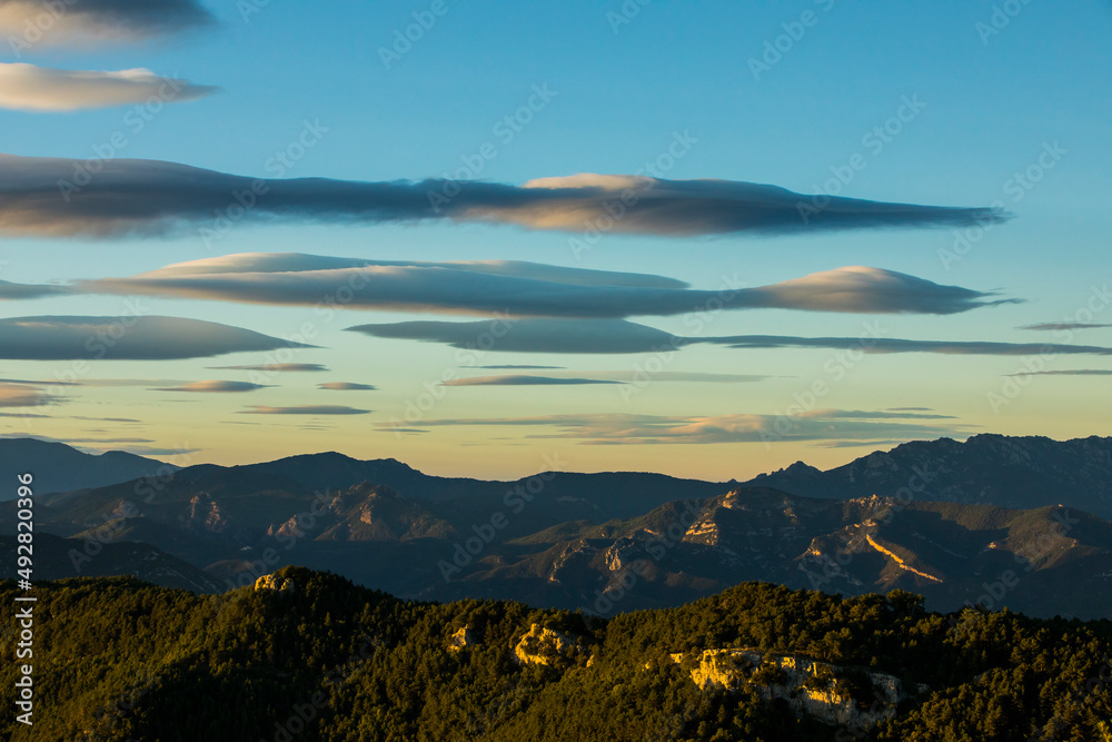 Sunset and wind clouds in La Garrotxa, Girona, Spain Sunset and wind clouds in La Garrotxa, Girona, Spain