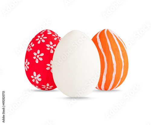 Hand painted red  orange and white Easter eggs decorated white lines and dots isolated on white. Colored easter eggs on white background