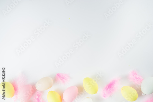 Flatlay of Easter eggs and feathers