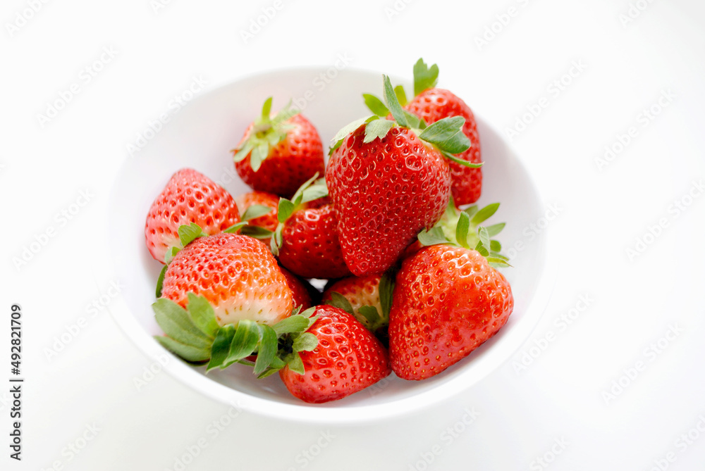 Fresh Organically Grown Strawberries in a White Bowl Fresh Organically Grown Strawberries in a White Bowl