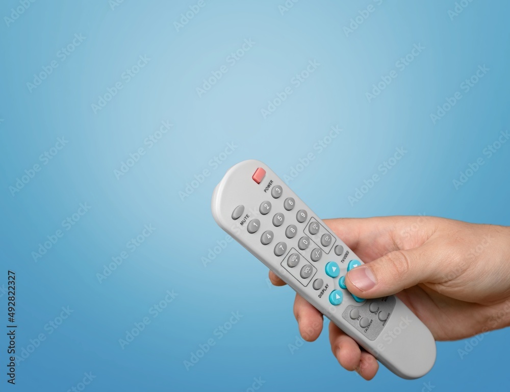 Manage home appliances, elements of a smart home with remote control. The control panel is in a hand. Manage home appliances, elements of a smart home with remote control. The control panel is in a hand.