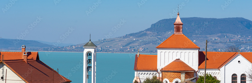 Obraz premium Nagybolgogasszony church in Fonyod Hungary with Lake Balaton background