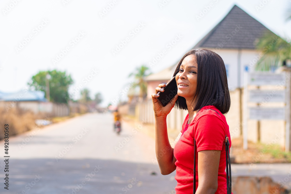 stressed young african lady making phone call