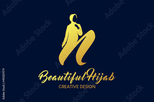 Hijab boutique logo design with the concept of a veiled woman in silhouette combined with the letter n. Hijab fashion logo vector illustration.