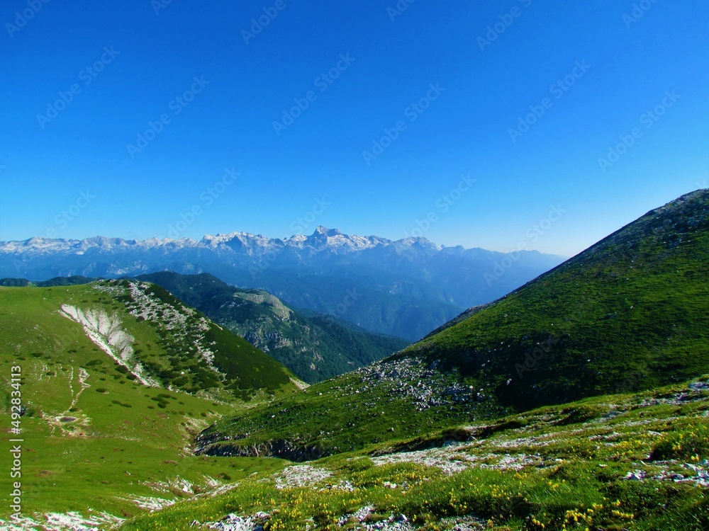 Scenic view of mountain Triglav in the Julian alps and Triglav natinal park in Gorenjska region of Slovenia taken from the slopes of Rodica with a alpine valley in front