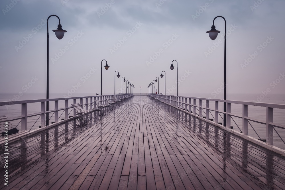 Beautiful pier on the Polish sea. Pier in Gdynia, Poland on a cloudy day.