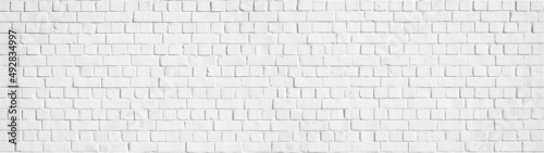 White gray light damaged rustic brick wall brickwork stonework masonry texture background banner panorama..