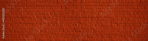 Red orange colored abstract rustic brick wall texture banner panorama