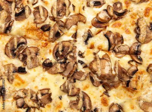 Pizza with champignons and cheese as a background.