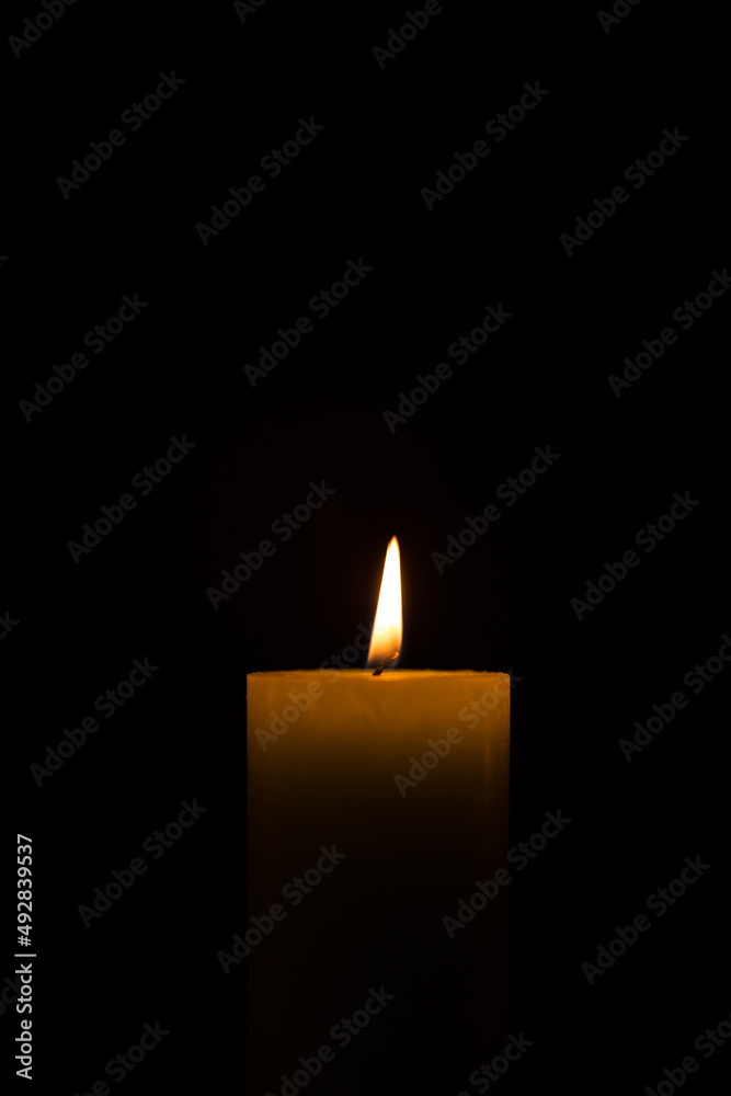 Warm candlelight on a dark mysterious background Warm candlelight on a dark mysterious background
