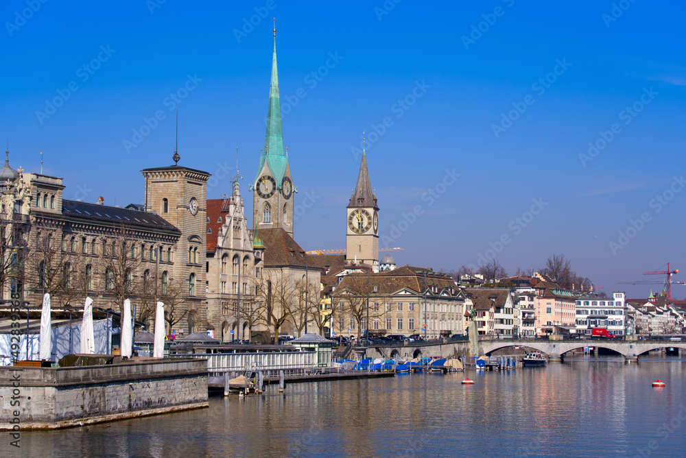 Skyline of the medieval old town of Zürich with river Limmat in the foreground on a sunny spring day. Photo taken March 3rd, 2022, Zurich, Switzerland.