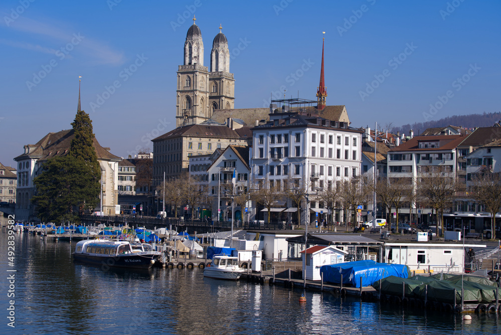 Skyline of the medieval old town of Zürich with river Limmat in the foreground on a sunny spring day. Photo taken March 3rd, 2022, Zurich, Switzerland.