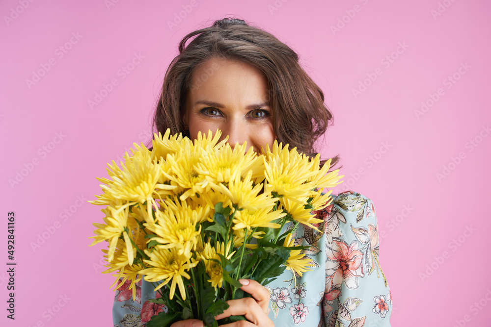 happy stylish female with long wavy brunette hair on pink happy stylish female with long wavy brunette hair on pink