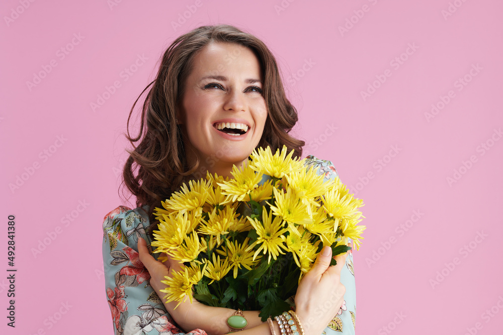 smiling woman with long wavy brunette hair on pink smiling woman with long wavy brunette hair on pink