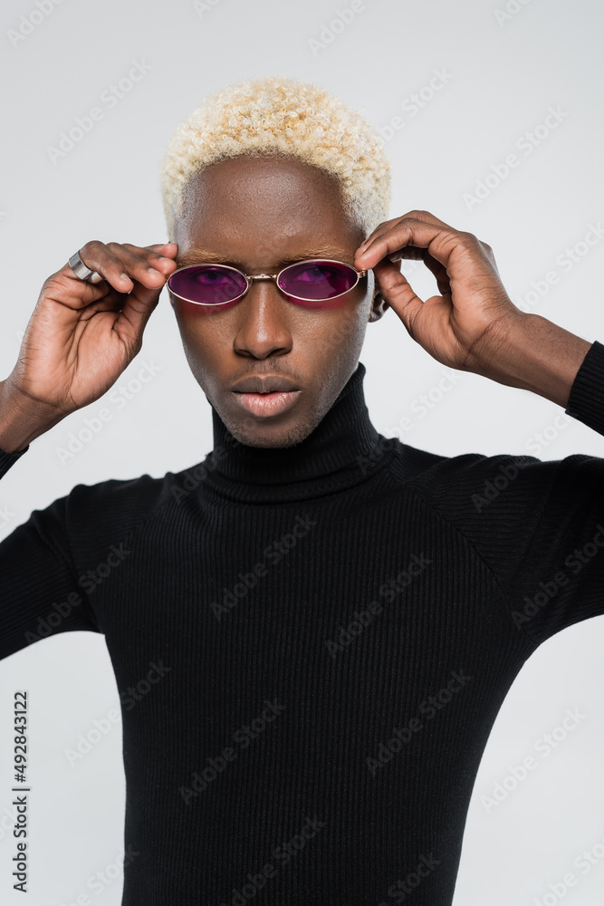 blonde african american man in turtleneck wearing pink sunglasses isolated  on grey Stock Photo | Adobe Stock