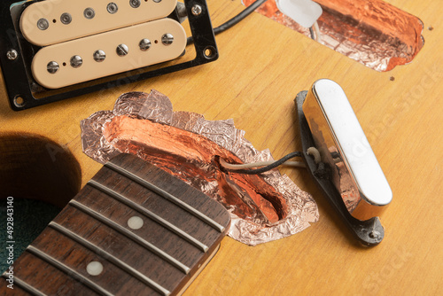 Shielding of the pickup housings of an electric guitar with copper tape